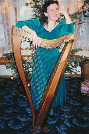 Laurel with her harp at Christmas